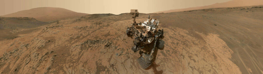 Martian Landscape Wallpaper: NASA Curiosity Rover in Dusty Sky