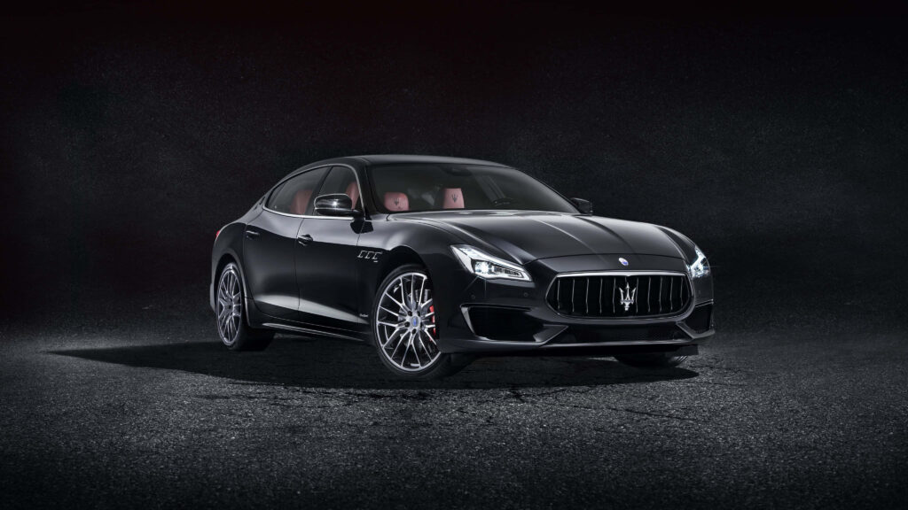 Sleek Maserati Ghibli Wallpaper: Luxurious Design on Dark Backdrop
