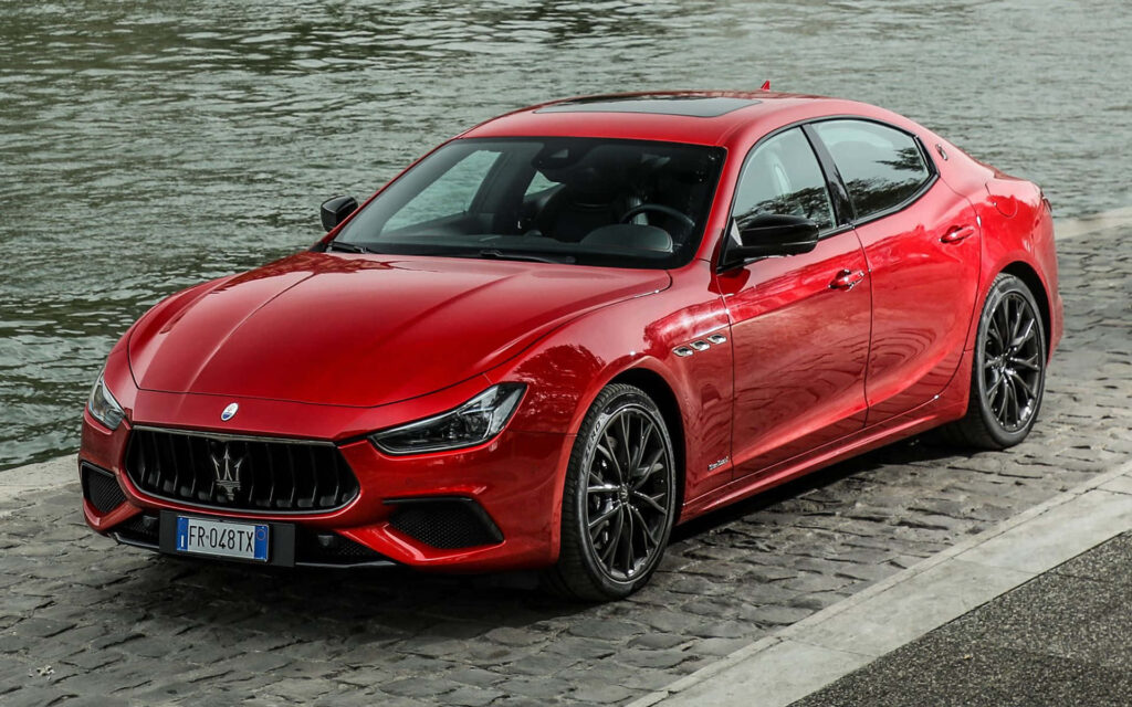 Elegant Maserati Ghibli Wallpaper: Red Sports Sedan by Riverside