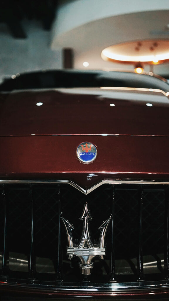 Luxury Red Maserati Wallpaper: Bold Grille & Iconic Trident Design