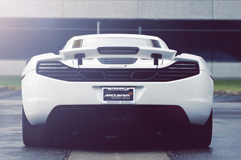 Stunning McLaren MP4-12C Rear View Wallpaper with Blurred Background