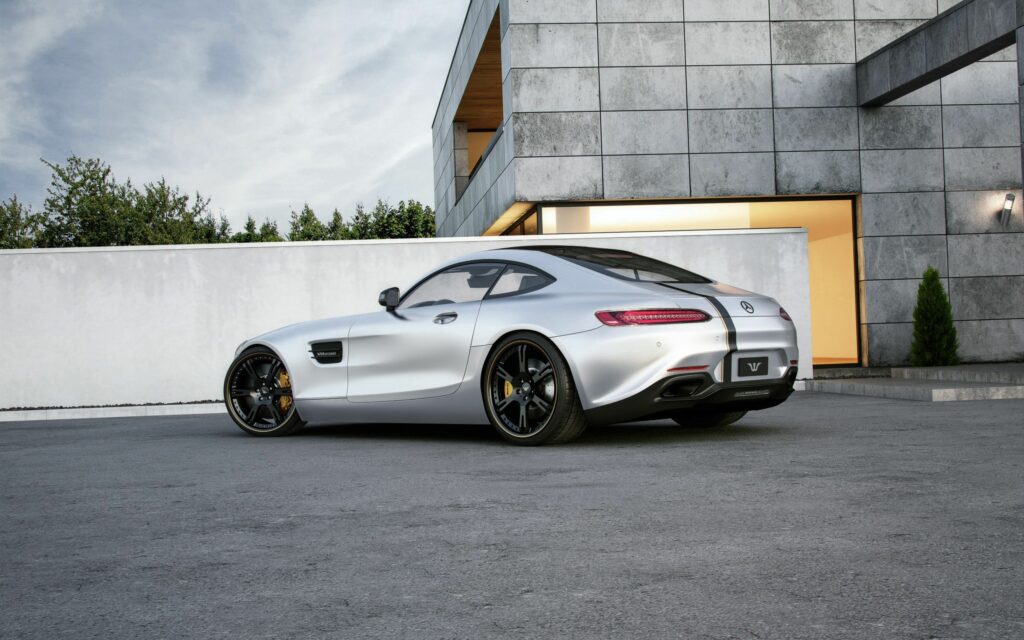 Sleek Silver Mercedes-Benz AMG GT: Elegant Design Against Modern Architecture Wallpaper