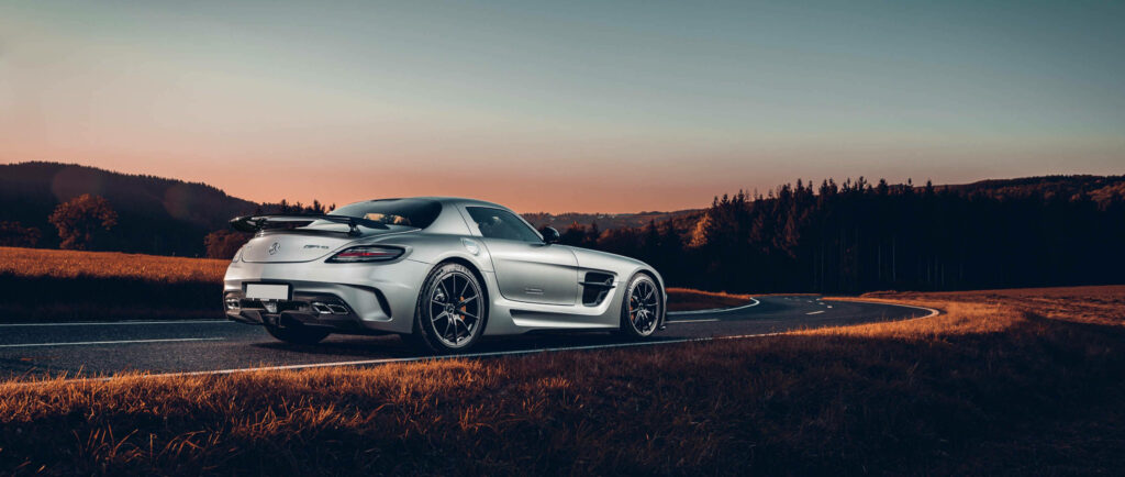 Stunning Mercedes-Benz AMG Wallpaper: Sunset Highway Scenic View