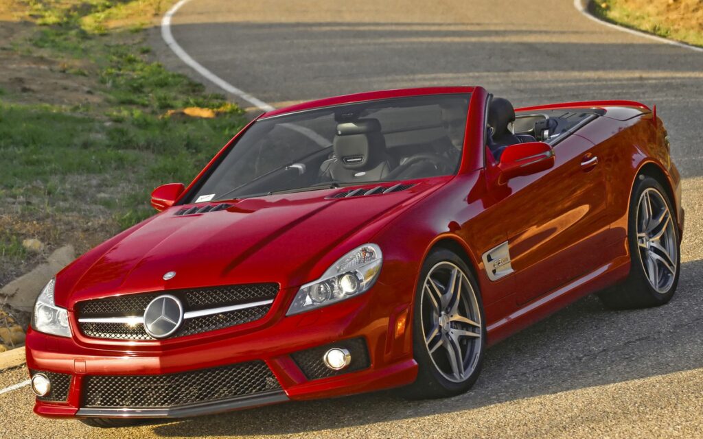 Sleek Red Mercedes SL 63 AMG Convertible Wallpaper - Luxury Design