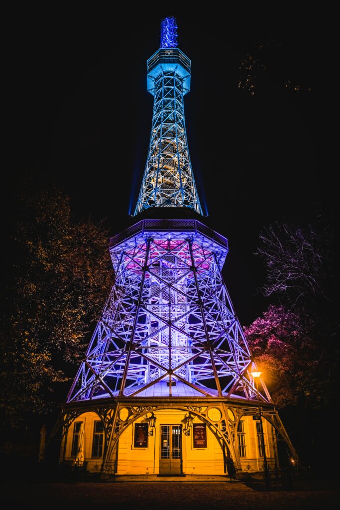 Vibrant Metallic Tower Wallpaper: Stunning Nighttime Architectural Design