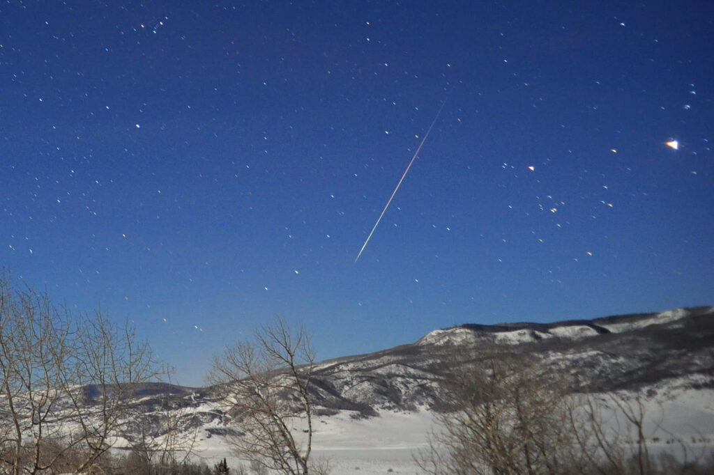 Stunning Meteor Wallpaper: Serene Starry Night Over Snowy Mountains