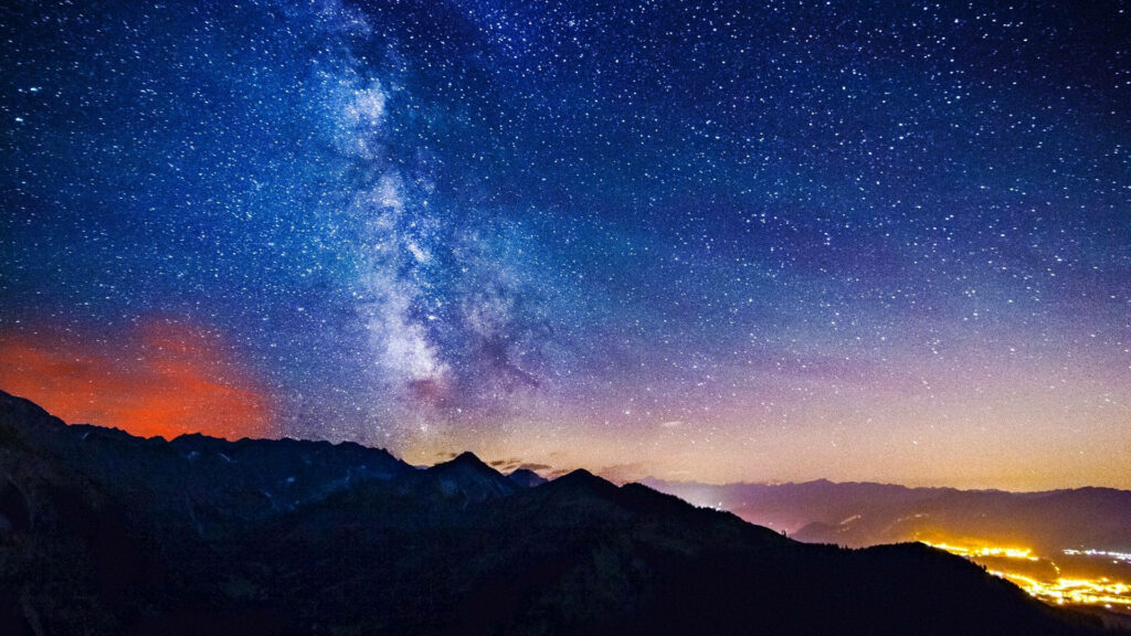 Stunning Milky Way Galaxy Wallpaper with Mountain & City Lights