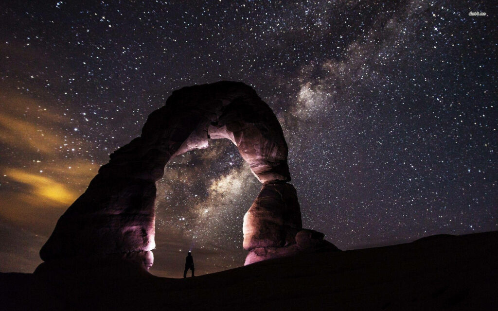 Stunning Milky Way Wallpaper: Serene Night Sky Over Majestic Rocks