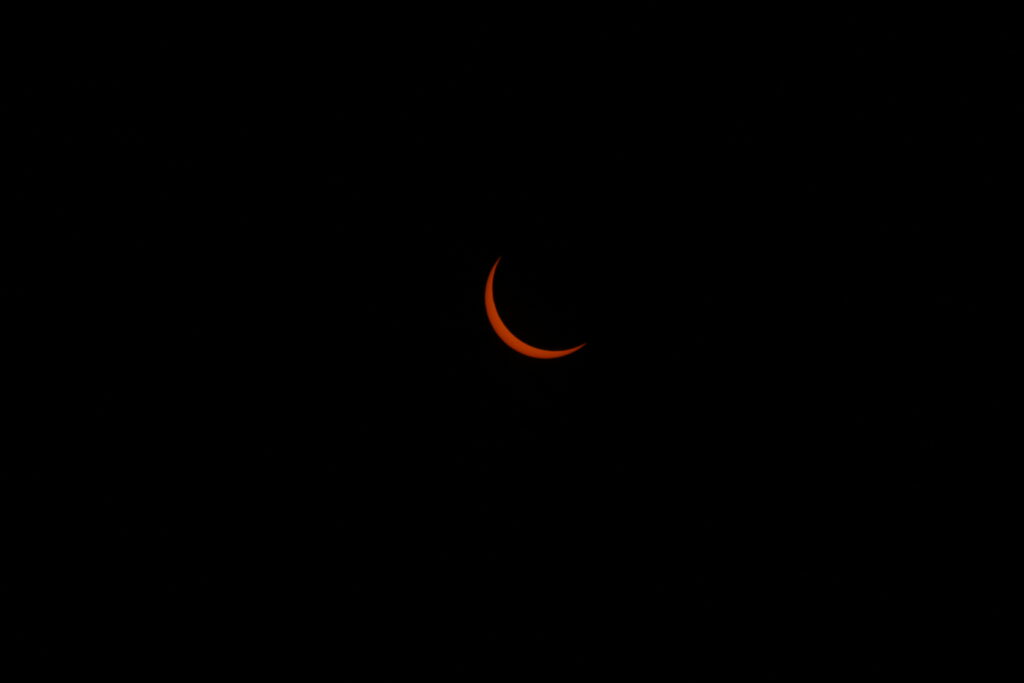 Minimalist Crescent Moon Wallpaper: Vivid Orange & Black Elegance