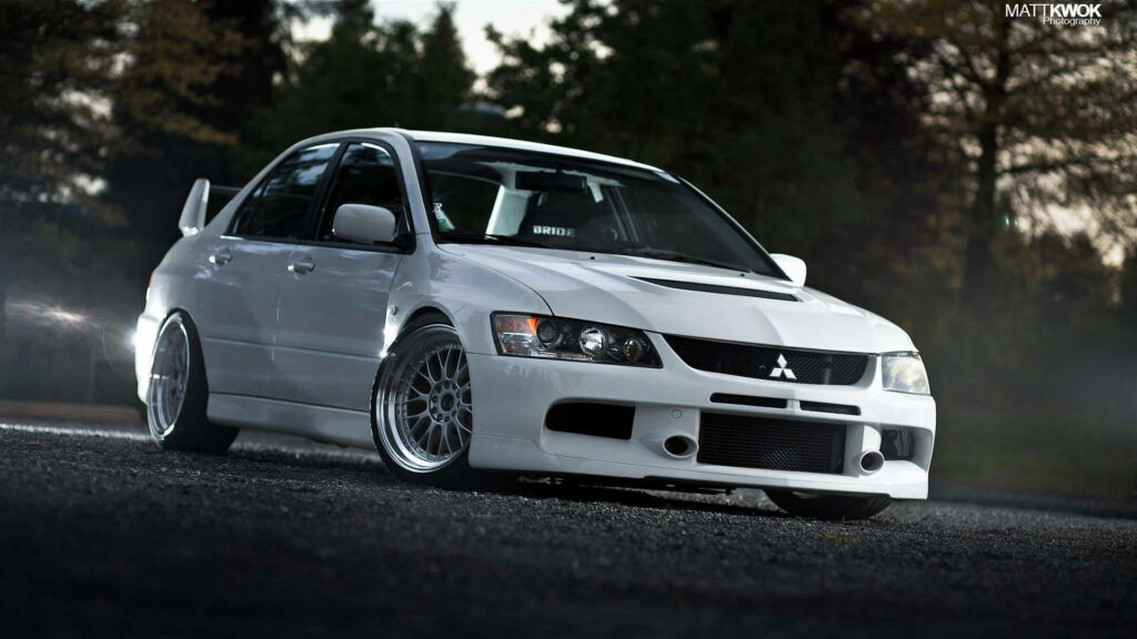 Stunning Mitsubishi Lancer EVO Wallpaper with Blurred Nature Background