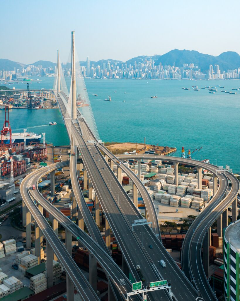 Stunning Cityscape Wallpaper: Architectural Bridge Over Ocean View