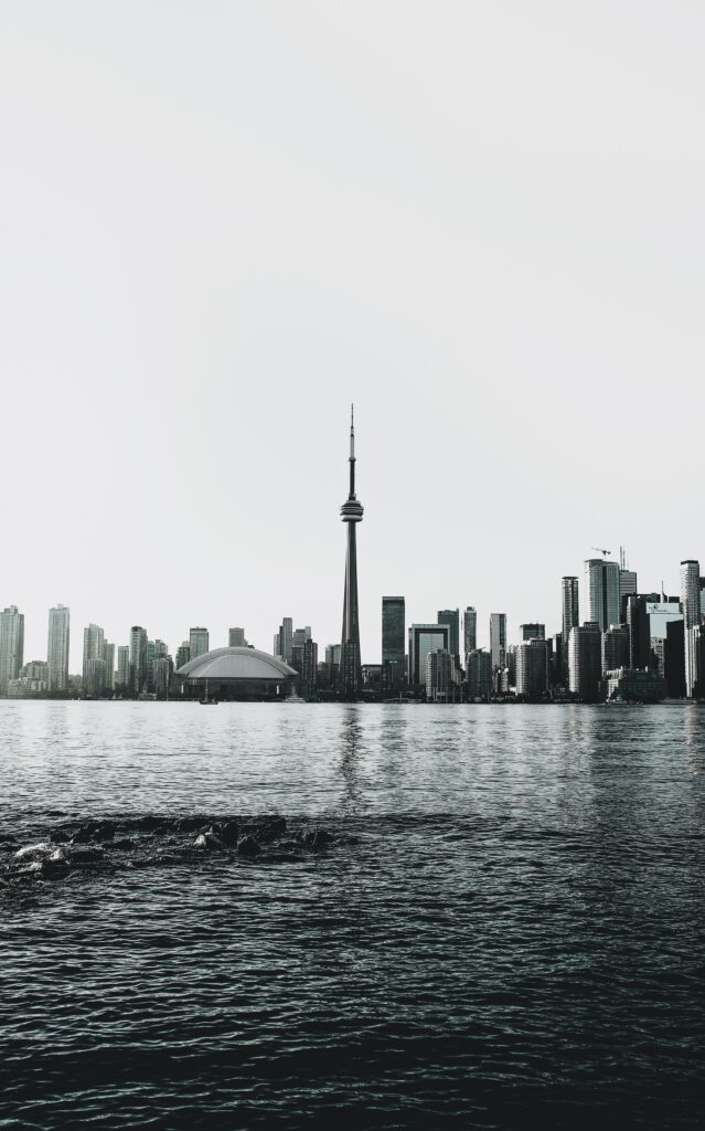 Serene Modern Cityscape Wallpaper: Sleek Architecture & Water Reflections