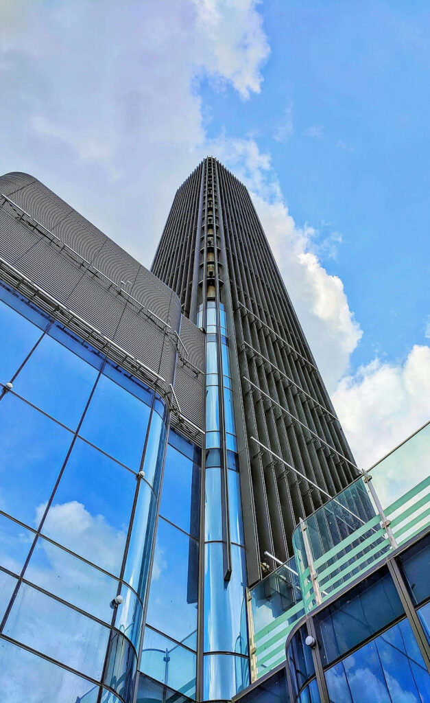 Modern Glass Building in Ho Chi Minh City - Stunning Wallpaper Background