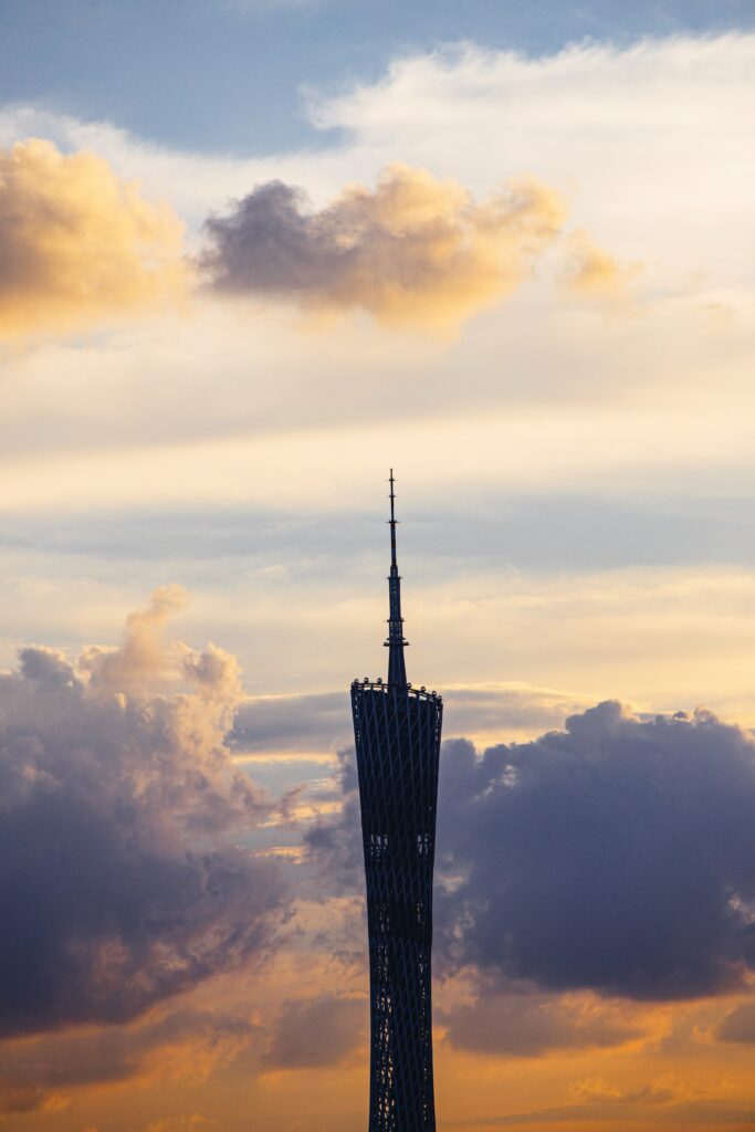 Modern Tower Wallpaper Against Dramatic Golden Cloudy Sky