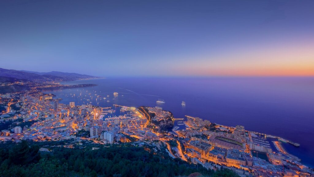 Stunning Monaco Night Panorama Wallpaper: City Lights & Ocean View
