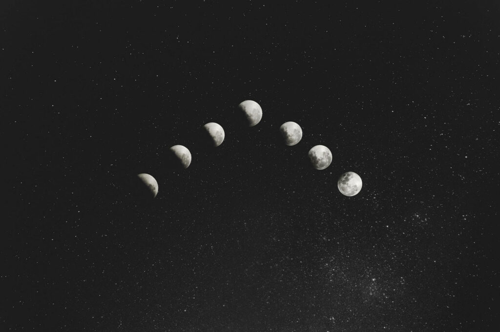 Celestial Moon Phases Wallpaper: Starry Night Sky Beauty