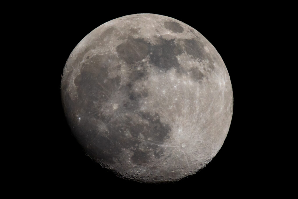 Stunning Moon Surface Wallpaper: Craters & Relief on Black Background