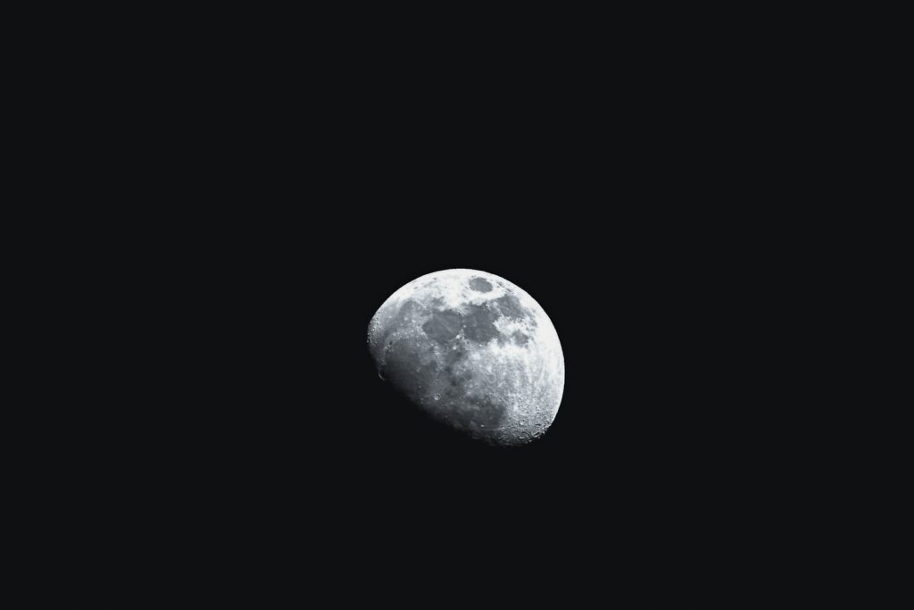 Mesmerizing Moon Wallpaper: Detailed Craters on Dark Background