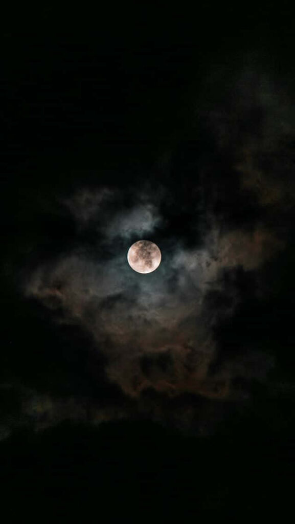 Breathtaking Moon iPhone Wallpaper: Night Sky & Dramatic Clouds