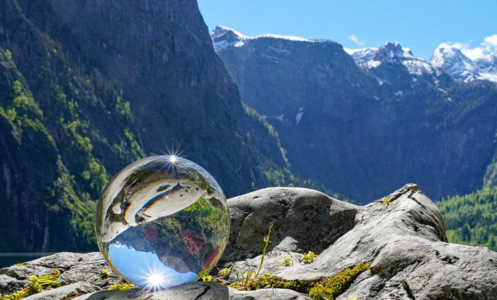 Stunning Mountain Reflection in Crystal Glass Ball - Peaceful Wallpaper