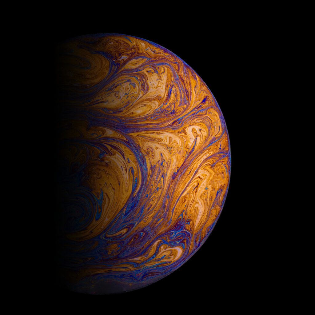 Stunning Multicolored Liquid Sphere Wallpaper on Black Background