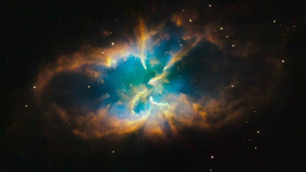 Dreamy hues of the cosmos captured in a mesmerizing multicolored nebula wallpaper