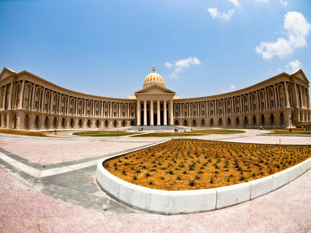 Grand Museum Wallpaper: Elegant Columns & Dome with Flower Bed