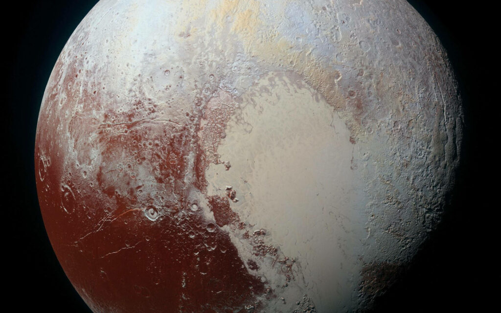Stunning Pluto Terrain Wallpaper: Vibrant NASA Image Background