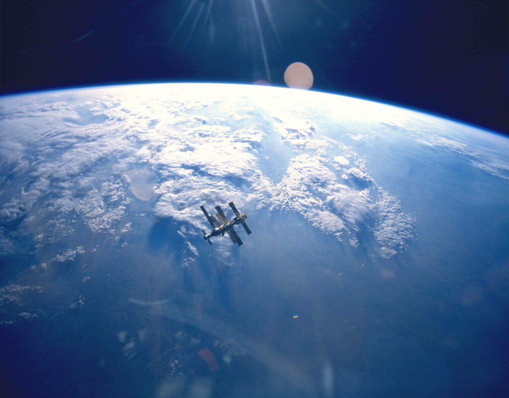 Stunning NASA Wallpaper: Earth from Space with Orbiting Station