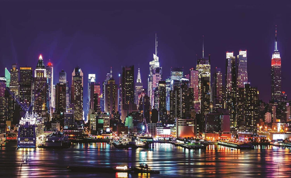 Vibrant NYC Night Skyline Wallpaper: Colorful Lights Reflected