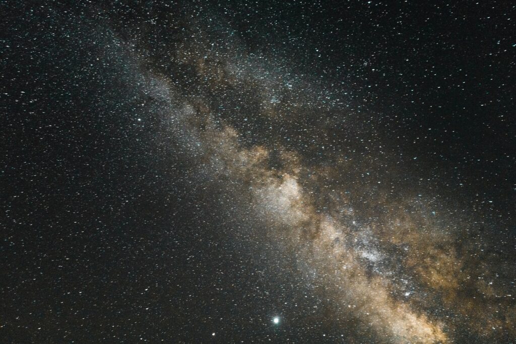 Stunning Nebula Wallpaper: Cosmic Brown Galaxy with Stars Background