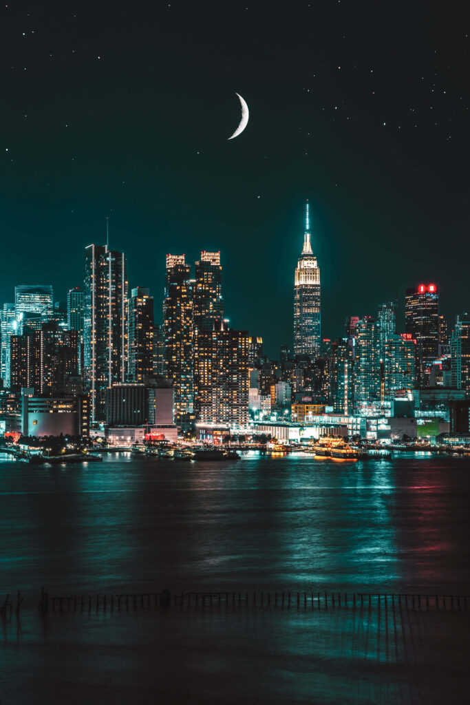 Vibrant Cityscape: Neon Lights & Starry Night Skyline Wallpaper