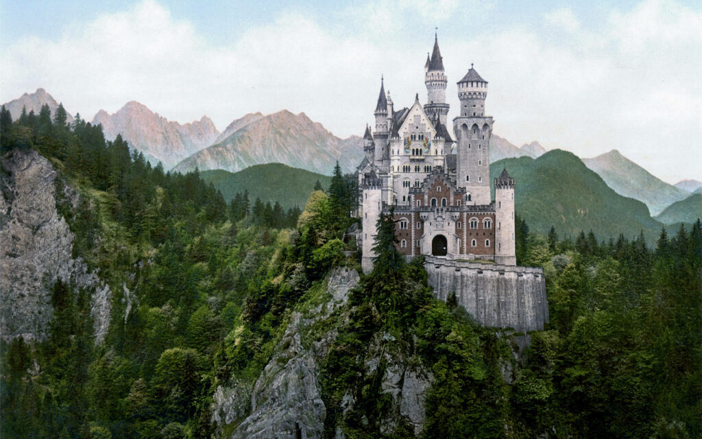 Stunning Neuschwanstein Castle Wallpaper: Lush Forests & Mountains