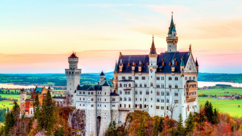Vibrant Neuschwanstein Castle Wallpaper: Sunset & Lush Landscape