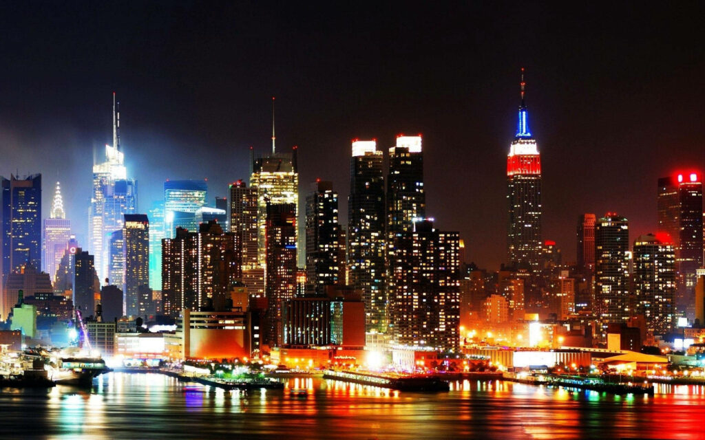 Stunning NYC Night Skyline Wallpaper: Illuminated Skyscrapers & Reflections