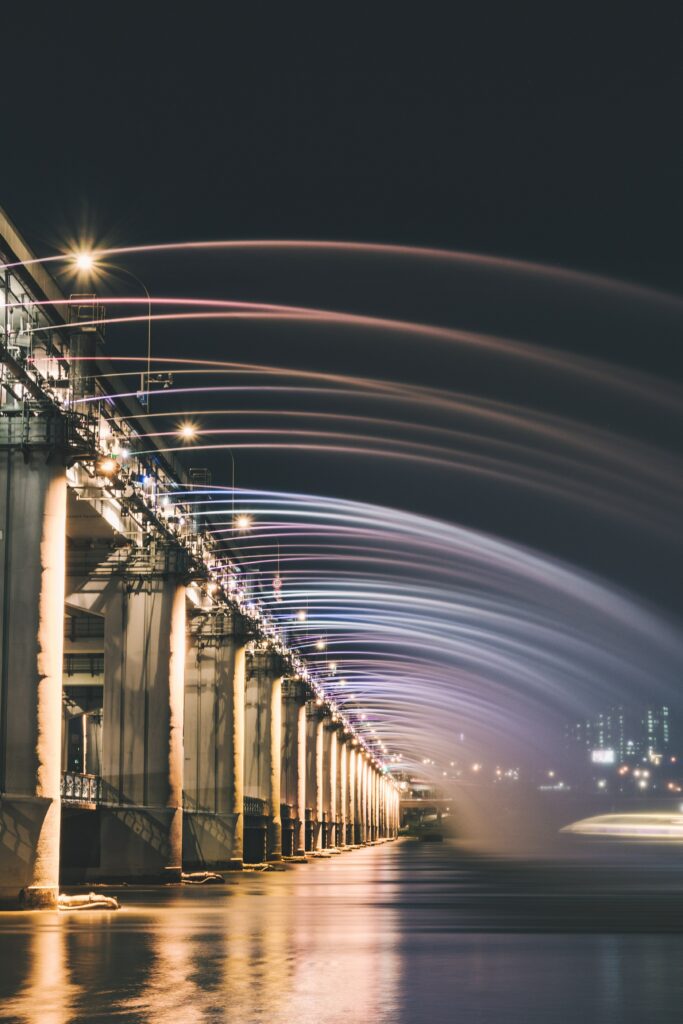 Stunning Night Bridge Wallpaper: Vibrant Lights & Peaceful Sky