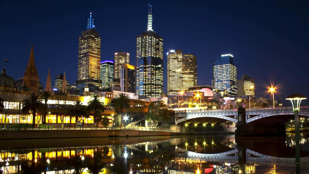 Stunning City Skyline at Night: Colorful Illuminated Wallpaper