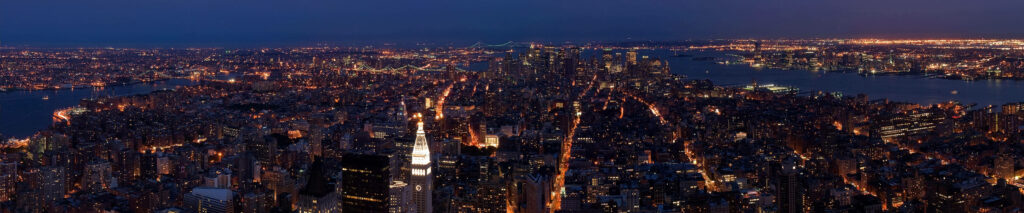 Stunning Three-Screen Night City Skyline Wallpaper Background