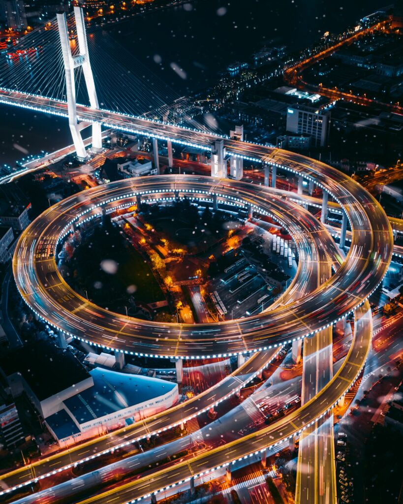 Vibrant Night City Aerial Wallpaper: Illuminated Interchange Design