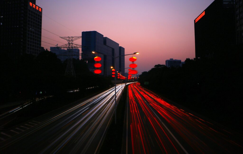 Mesmerizing Night Cityscape Wallpaper with Red Lanterns & Light Trails