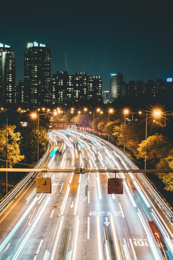 Stunning City Night Wallpaper: Illuminated Buildings & Vibrant Roads