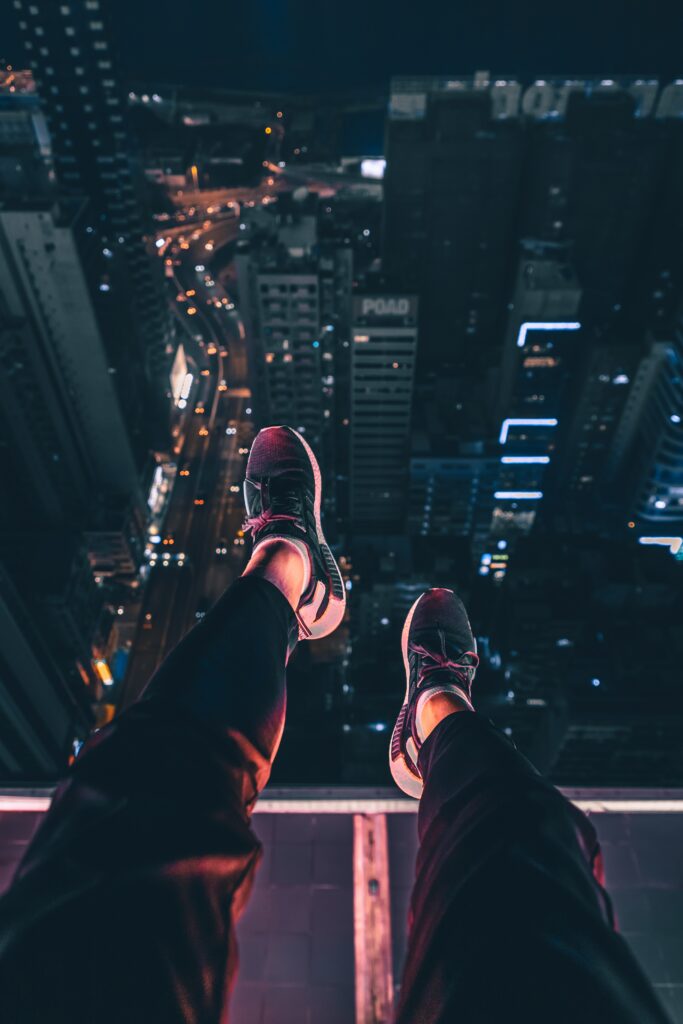 Stunning Rooftop Night Cityscape Wallpaper: Aerial Urban Glow View