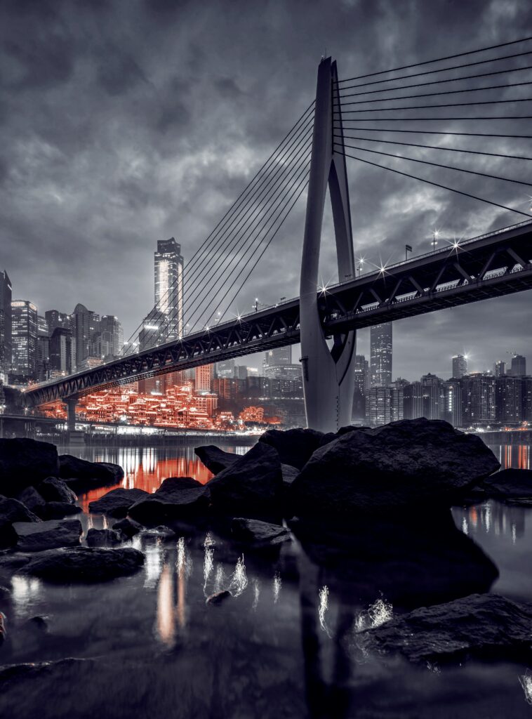 Stunning Night Cityscape Wallpaper with Illuminated Bridge & Reflections