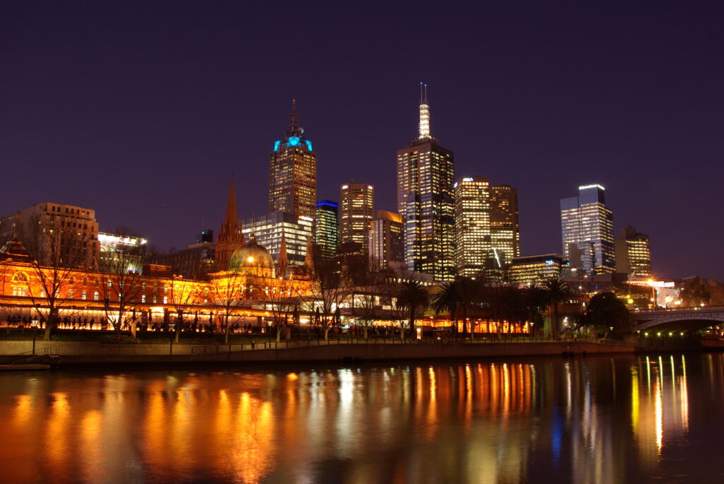 Stunning Night Cityscape Wallpaper: Illuminated Reflections & Urban Beauty