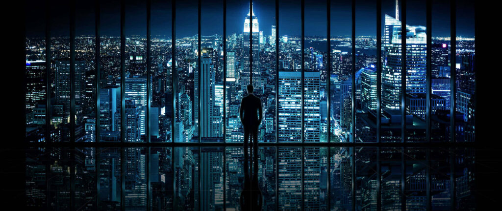 Stunning Night Cityscape Wallpaper: Man in Modern High-Rise