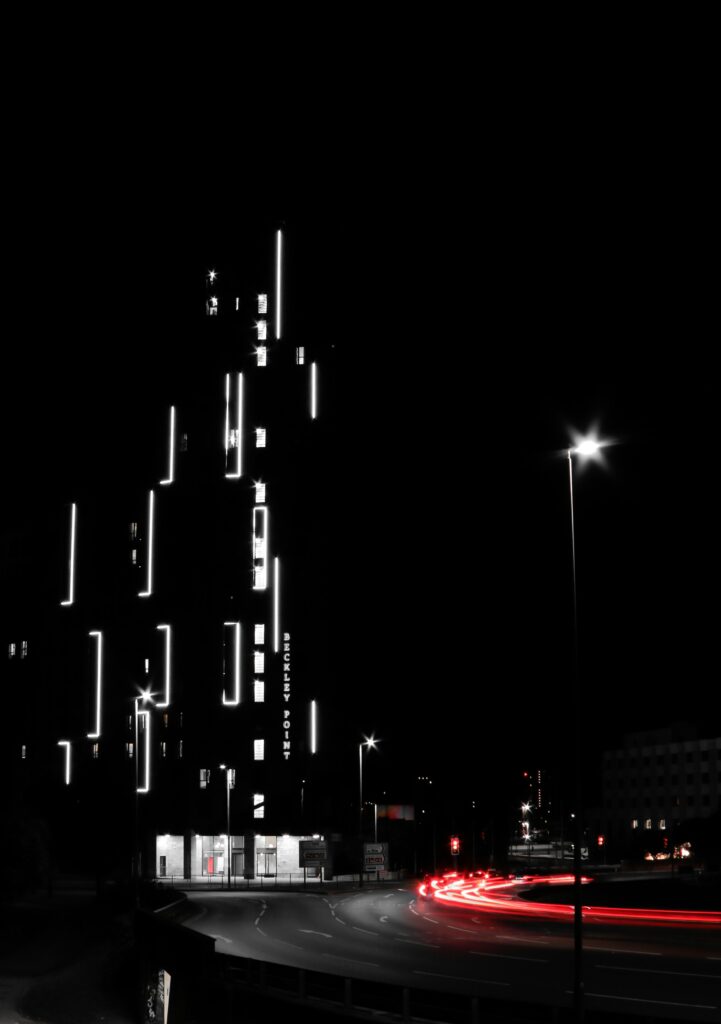 Vibrant Night Cityscape Wallpaper with Illuminated Modern Building