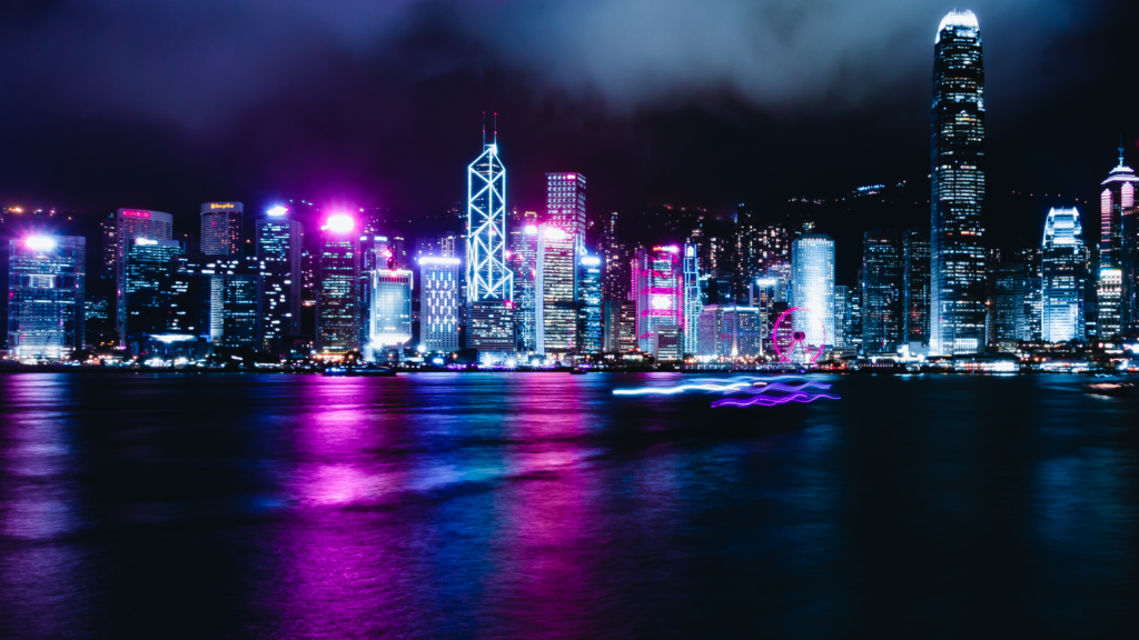 Vibrant Neon Night Cityscape Wallpaper with Skyscrapers & Reflections