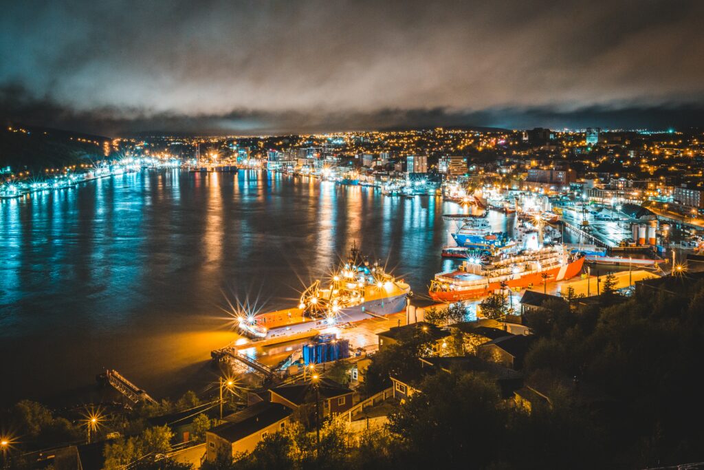 Stunning Night Cityscape Wallpaper with Vibrant Pier Lights