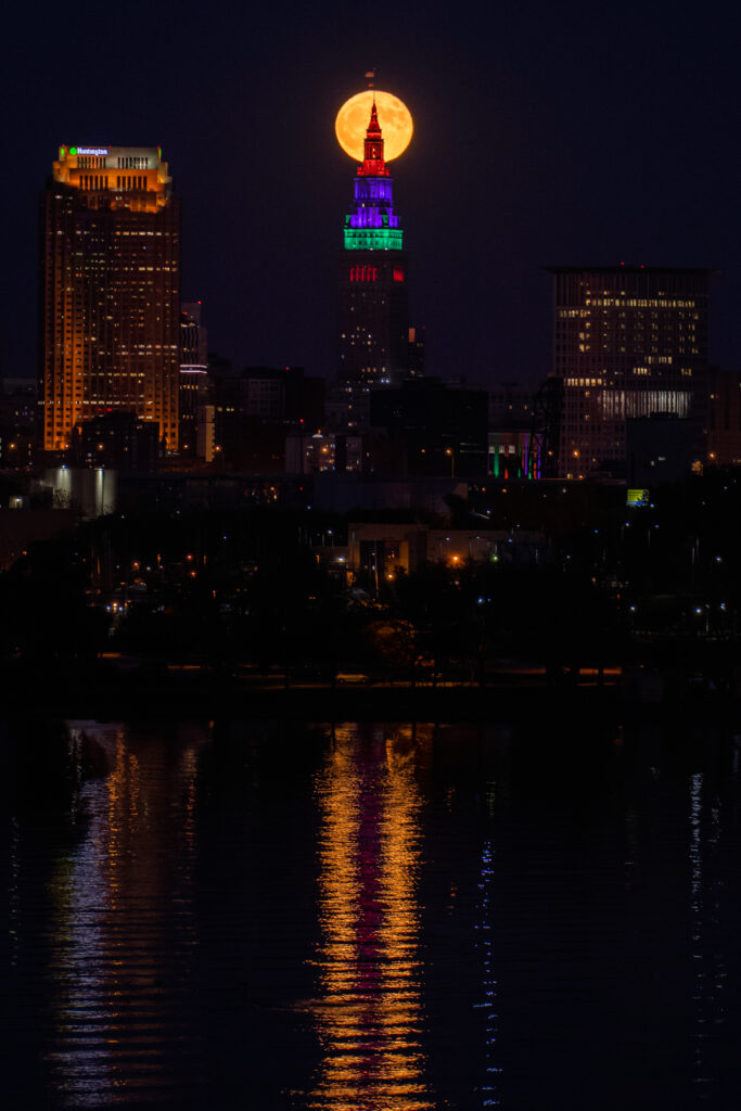 Serene Cityscape Wallpaper: Stunning Night View with Moonlit Reflection