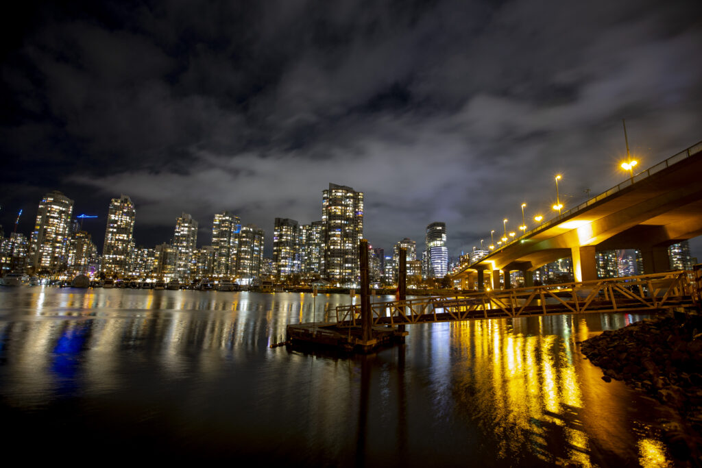 Stunning Night Cityscape Wallpaper with Illuminated Bridge & Reflections